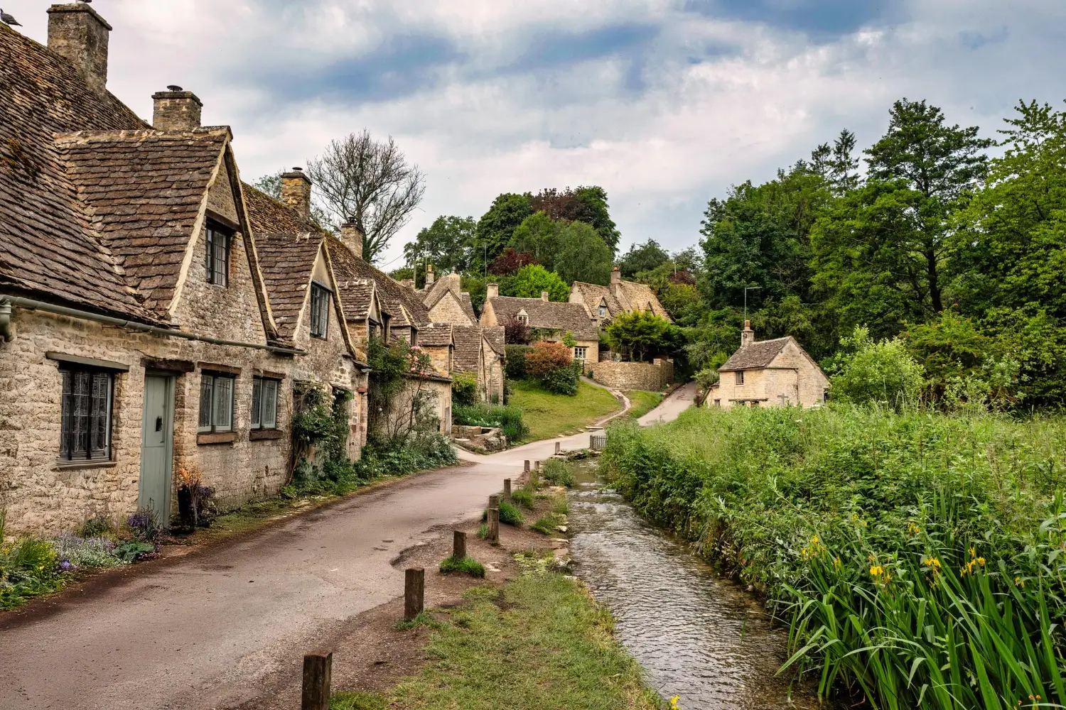 Cotswolds honey-stone village with flowers